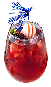 Freedom Punch with apples, strawberries, blueberries, and decorative stirrer